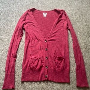 Light red five button cardigan.